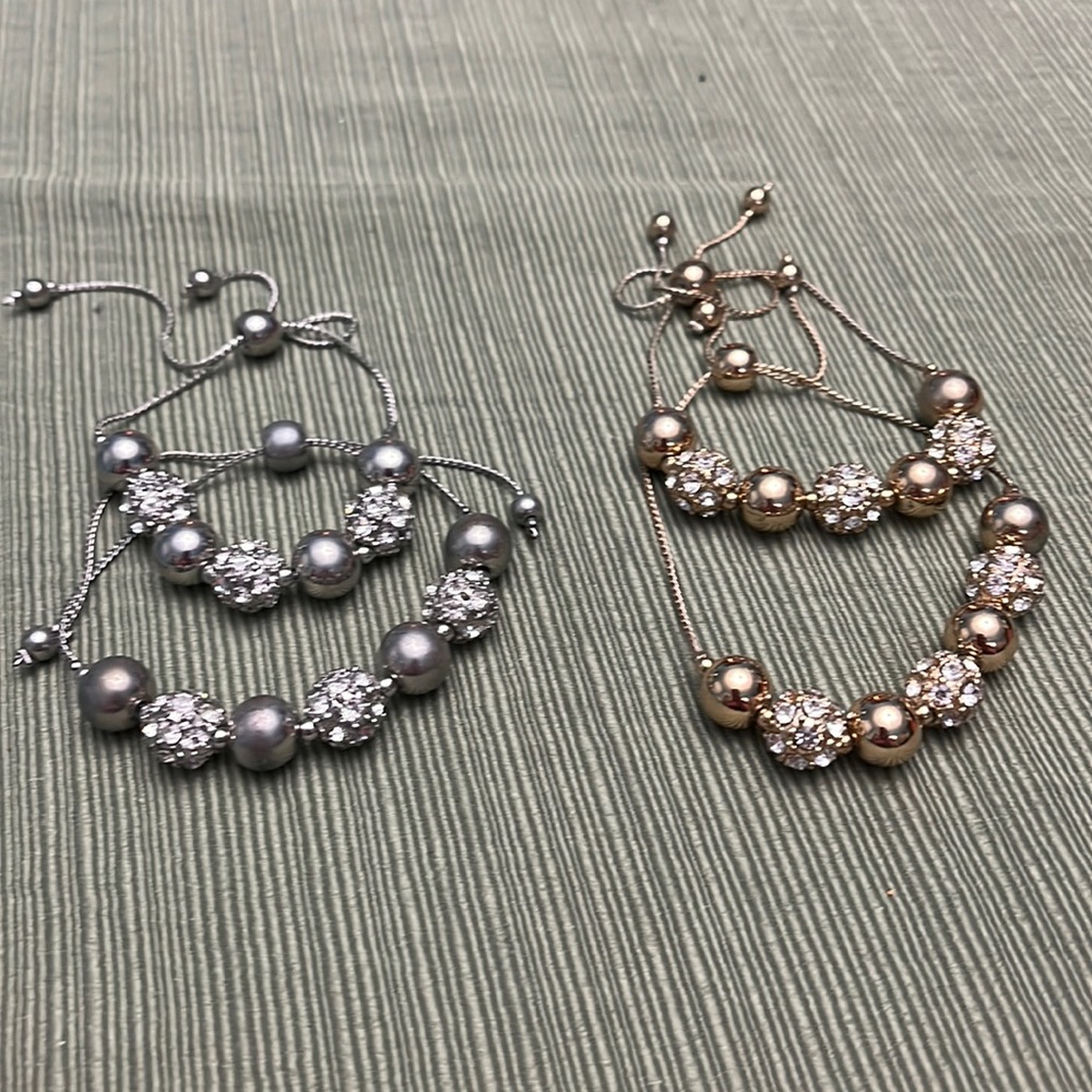 Used 4 slide adjust bracelets, alternating metallic and rhinestone beads